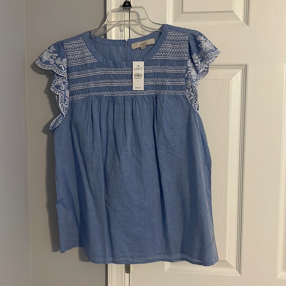 Denim blouse.